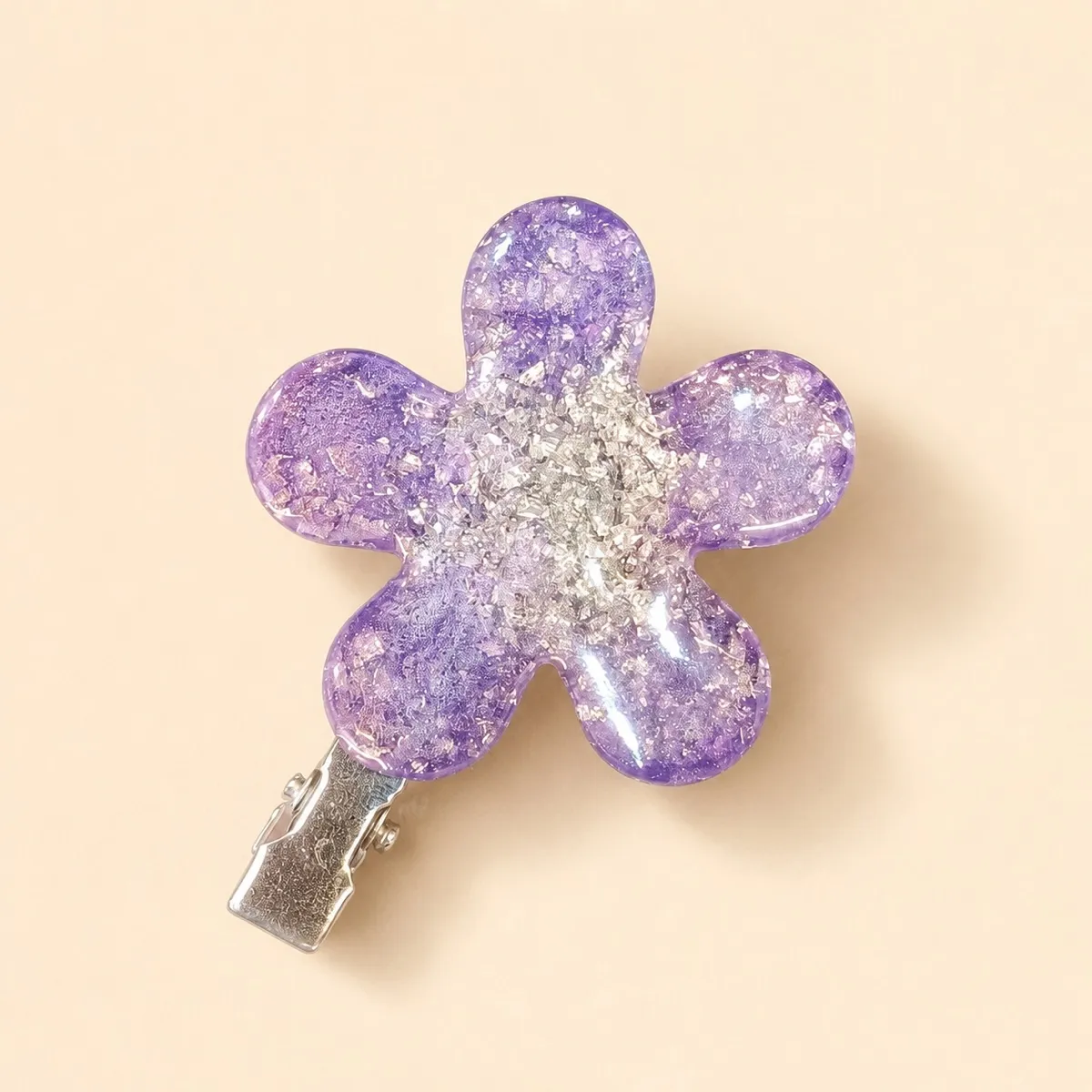 Lilac five-petal resin flower hair clip with silver flake through the centre, on a silver alligator clip